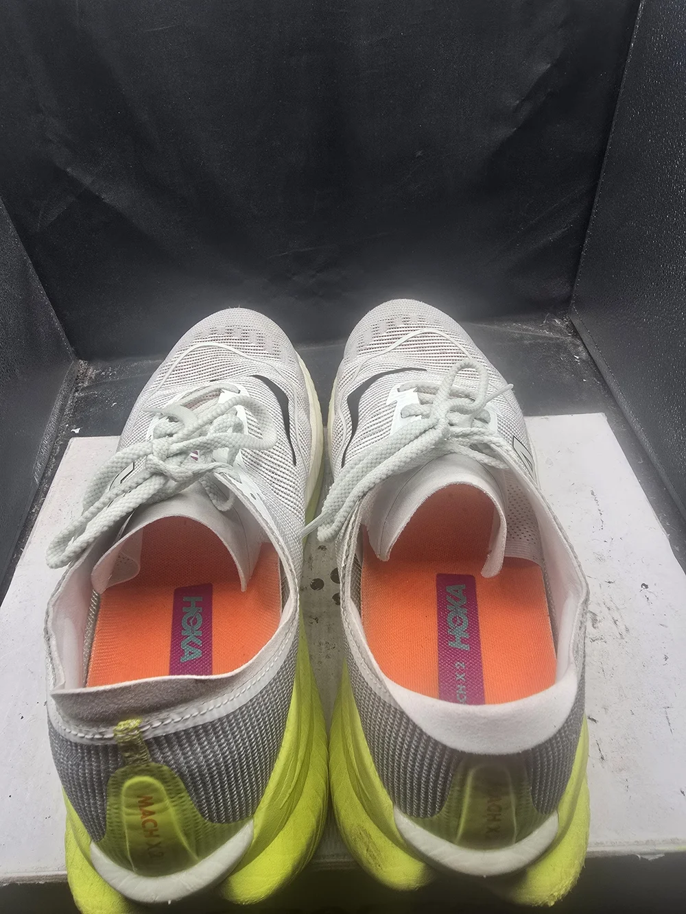 Hoka Kids White Sneakers with Black Swoosh and Orange Accents